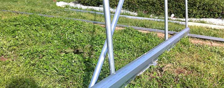 Metal baseboards for high tunnels